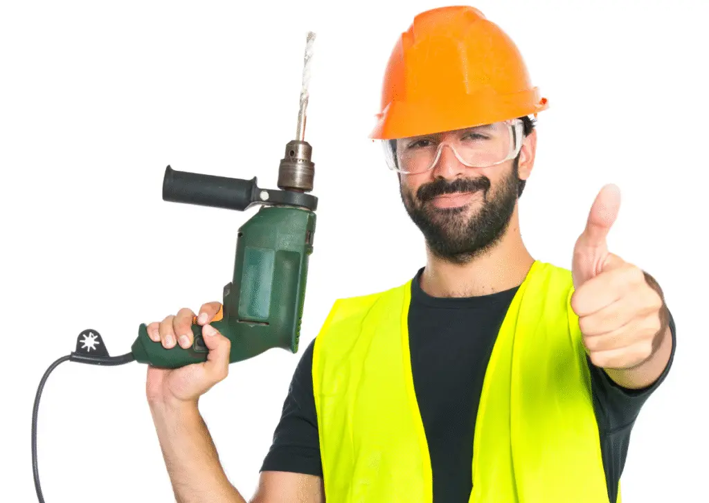 Garage door repair technician holding drill and giving thumbs up in Hopkins MN