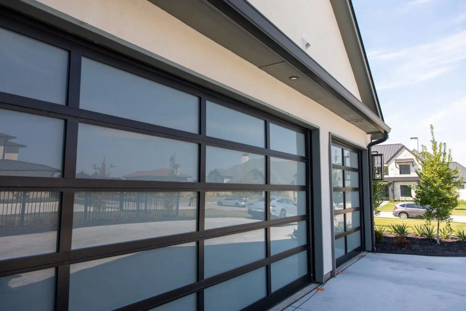 "Modern residential garage door with horizontal panels on a home exterior"